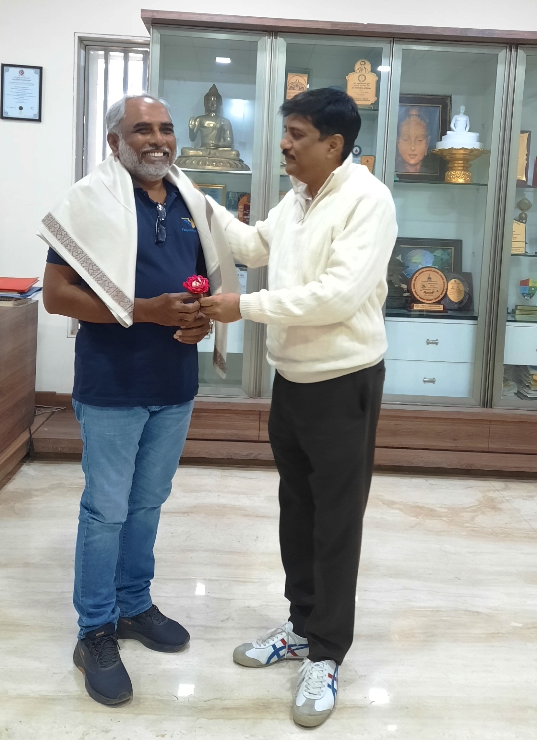 Felicitation of Bos Member Mr. Milind Ghokde, Director falconexim